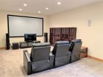 Escape to the lower level to enjoy movies and more on the 10 ft. Home Theater room with reclining leather chairs